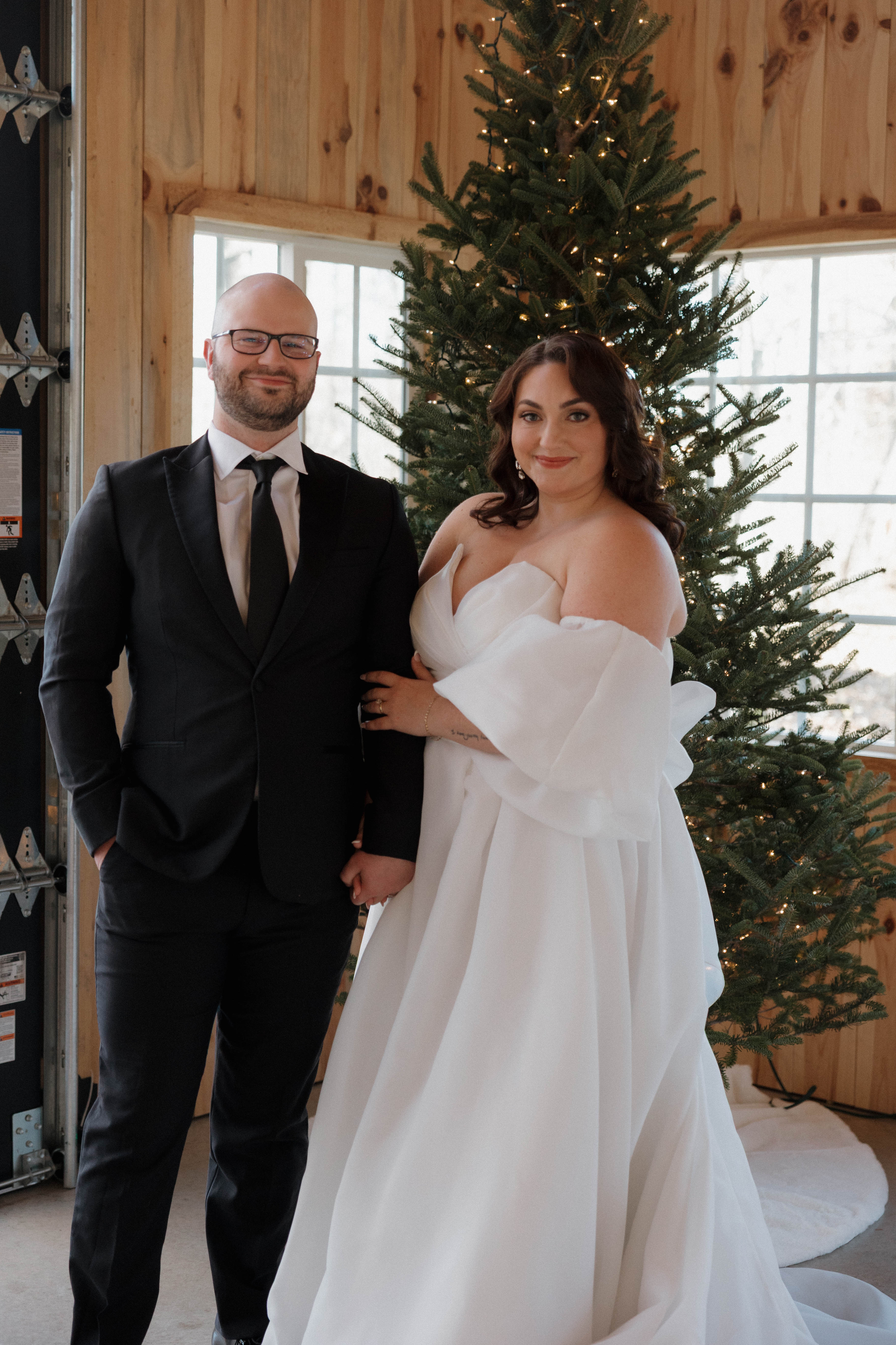 A couple sharing a wedding toast in the warm light of The Emerald Cottage